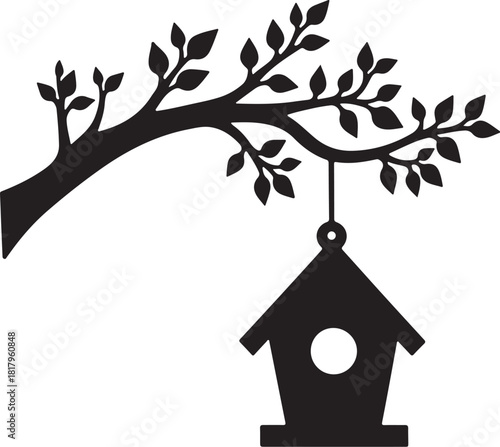 Black silhouette of birdhouse hanging from tree branch