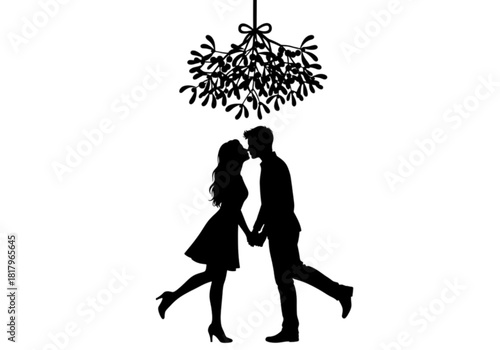 Romantic silhouette of a couple holding hands and kissing under mistletoe.