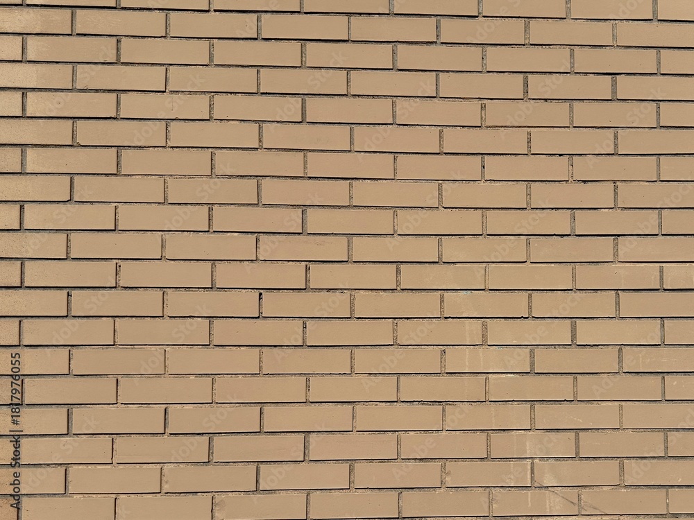 Fototapeta premium Light yellow orange pastel brick wall