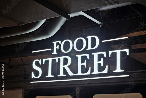 Modern Food Street sign on dark background.