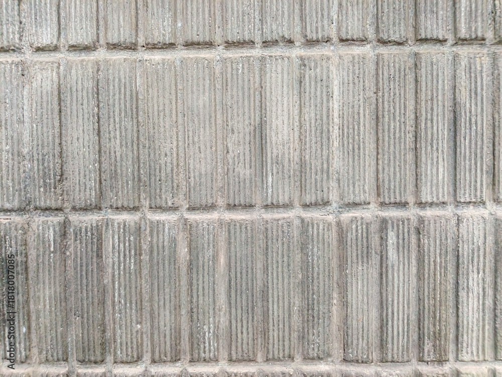 Φωτογραφία Seamless gray concrete wall background with textured vertical grooves for urban design, grunge, and industrial wallpaper concepts