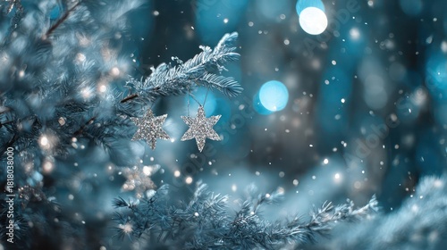 Close up of a frosted evergreen branch with delicate snowflakes falling and soft blue bokeh lights in the background