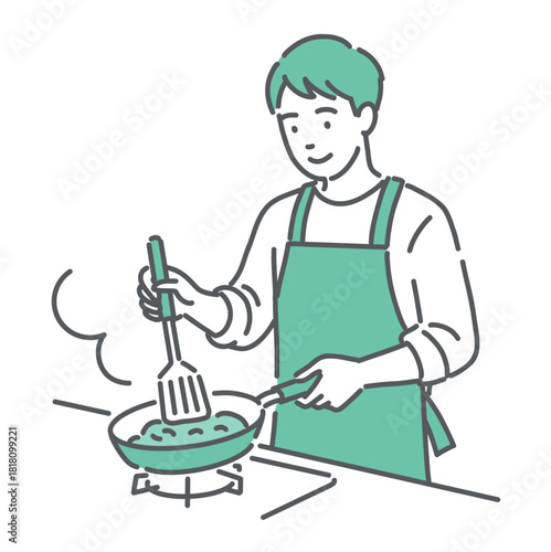 フライパンで料理を作っている若い男性