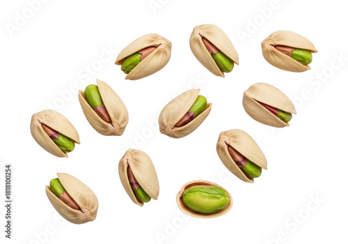 Scattered pistachios on a dark background