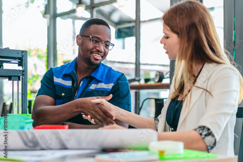 Engineer and Product Designer Reviewing Technical Blueprints