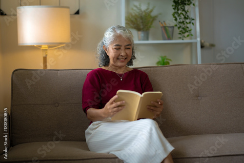 A mature retired female enjoying reading book, Retirement Leisure Concept