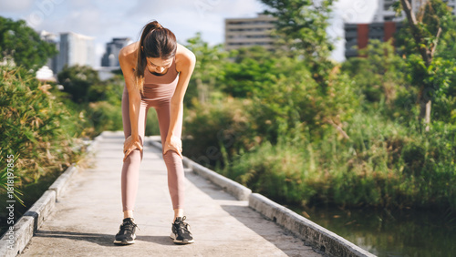 Adult asian sporty woman heart breathing chest problem asthma artery disease from running workout painful face expression