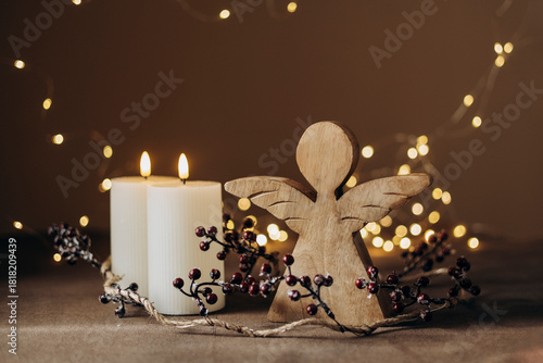Advent white candles with decor in shiny lights closeup