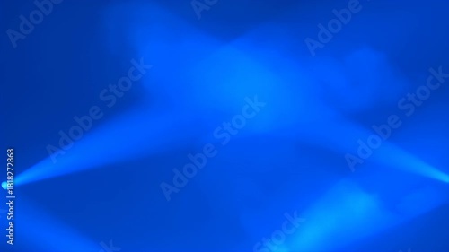 Mysterious blue stage lights cutting through atmospheric smoke effect