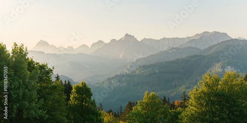 Fototapeta Naklejka Na Ścianę i Meble -  Breathtaking view of lush green trees and towering mountains, ideal for nature lovers and travel photography