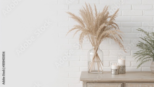 Vase with dry reeds and bur...