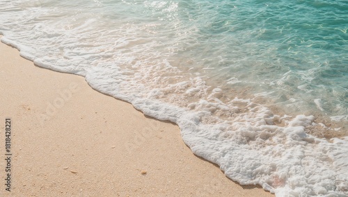 A gentle blue ocean wave cr...