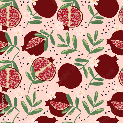 Pomegranates with leaves on a light pink background. Seamless cute fruit pattern for textiles or wrapping paper. 