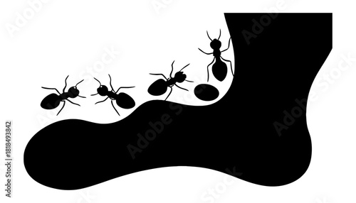 Silhouette of ants walking on black shape against a white background