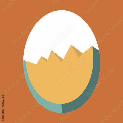 Cracked easter egg with orange yolk on a brown background