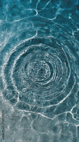 Ripple Effect: A close-up view captures the mesmerizing dance of water, where a single drop creates concentric circles, radiating outwards across the pristine surface.