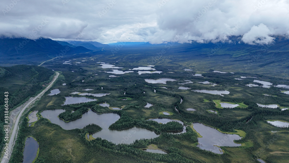 Αυτοκόλλητο Discover breathtaking Alaskan wilderness with serene lakes and vast landscapes,