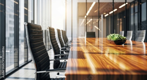 Modern conference room with large windows and wooden table and black leather chairs view