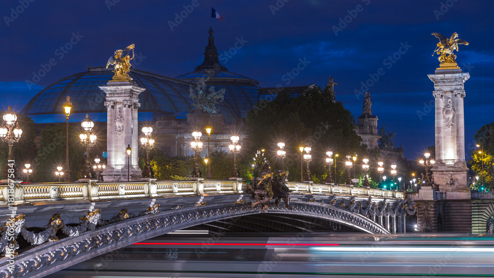 Obraz premium Alexandre Bridge in Paris at night in illumination day to night timelapse. Paris, France
