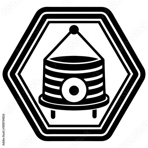 Stylized hexagonal emblem with a suspended cylindrical object silhouette isolated on white background