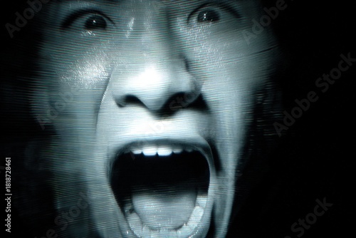 A distorted, close-up, mono...