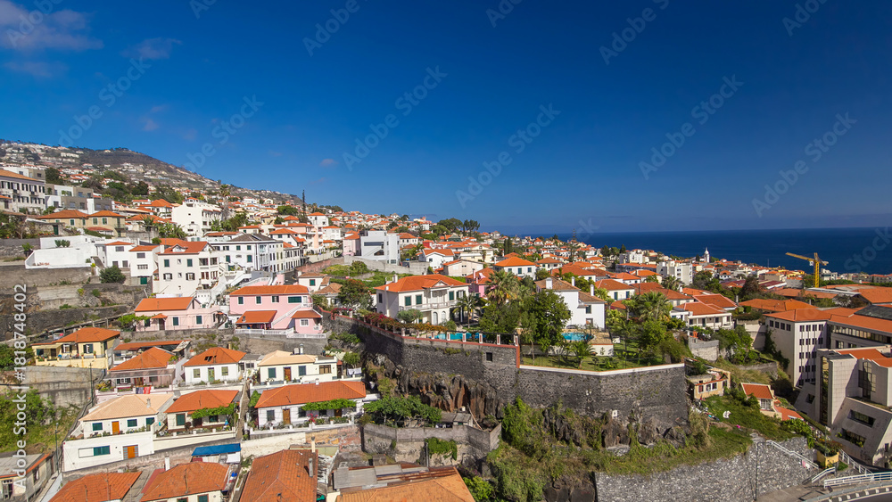Obraz premium Aerial view from the mountain over the rooftops from cable car on Madeira timelapse hyperlapse.