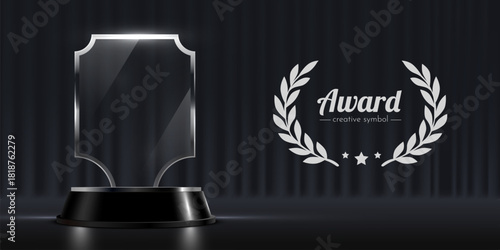 Elegant Glass Award Trophy and Laurel Wreath on Dark Stage Background.