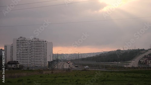 General plan of the city with hilly terrain in summer at sunset