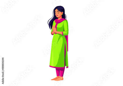 Young indian woman in traditional green salwar kameez with pink dupatta, praying or meditating with hands clasped in front of chest, isolated on