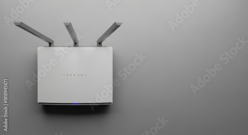 Modern wireless router on light gray wall, close up. Wireless router for high speed internet access at home or in office ensures seamless connectivity, offering reliable network capabilities.
