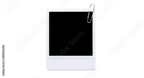 White instant photo frame with silver paper clip attached to the top right corner isolated on a transparent background