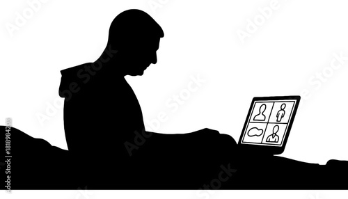 Man silhouette using laptop for video conference at night
