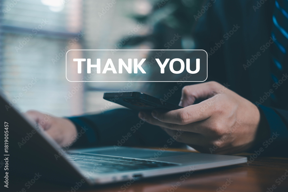 Fototapeta premium A businessperson interacting with a digital thank you message on a laptop, representing appreciation, gratitude, positive communication, customer relationships, and professional acknowledgment.