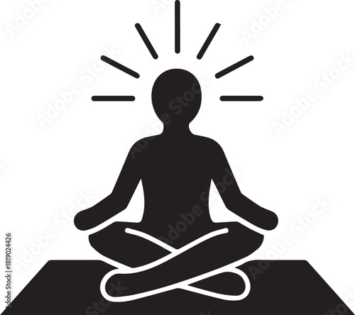 Silhouette of a person meditating in a lotus pose on a mat with radiating light symbolizing enlightenment and inner peace