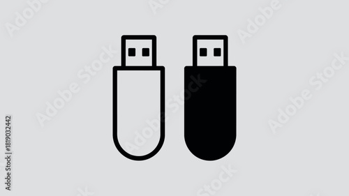 Two usb flash drives one white and one black on a grey background