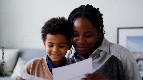 Mother and Son Reading Together with Smiles.