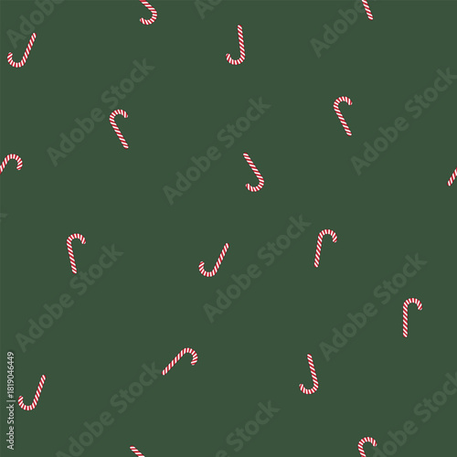 Bold and eye-catching seamless design with diagonally placed classic candy canes contrasted against a solid green background, excellent for merchandising.