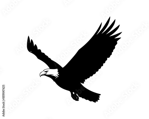 Silhouette of a majestic eagle in flight, symbolizing freedom and power against a white background