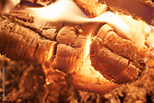 Close-up of a hearth. Wood burning in a rustic stove. Photo taken with a long exposure.