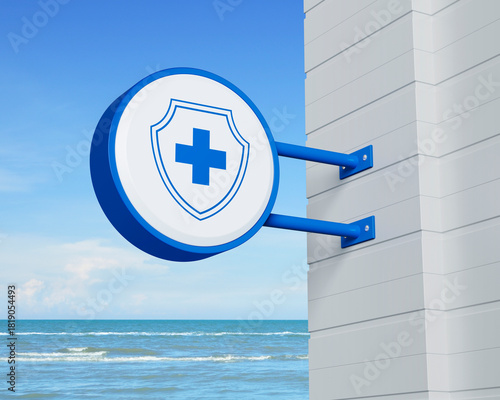 Cross shape with shield flat icon on hanging blue rounded signboard over tropical sea and sky, Business healthy and medical care insurance concept, 3D rendering