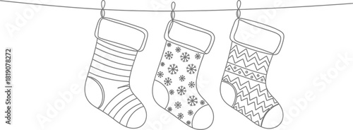 Three christmas stockings hanging on a line illustration
