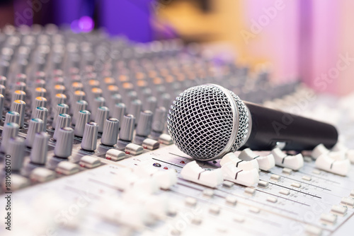 dynamic microphone on audio mixing console. singing, recording concept