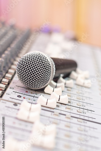 dynamic microphone on audio mixing console. singing, recording concept