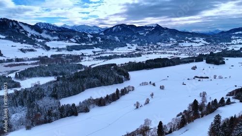 Wallpaper Mural Moving over the snow-covered plains and pine-tree woods. Amazing beautiful mountains under the cloudy sky at backdrop. Winter nature. Torontodigital.ca