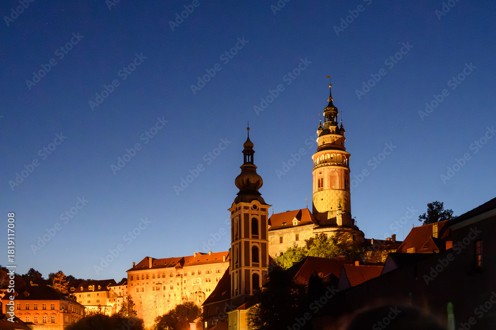 Fototapeta premium Cesky Krumlov in the evening from a boat on the Vltava River