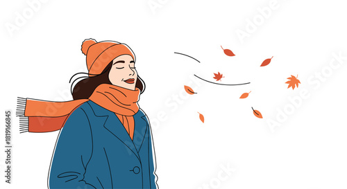 Young woman enjoying a breezy autumn day with leaves falling around her.