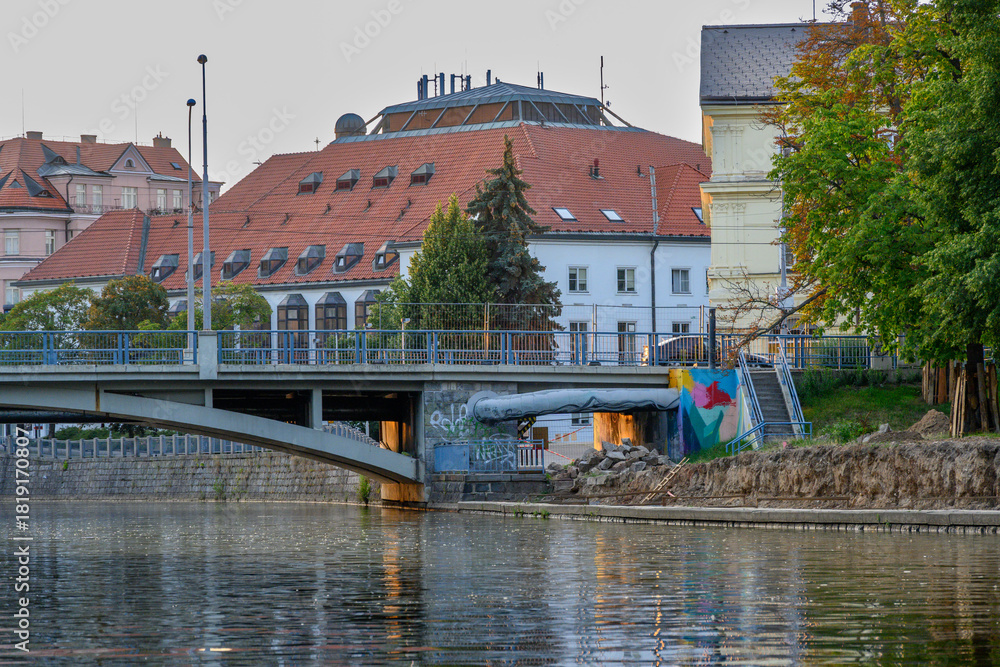 Obraz premium view of bridges and buildings in Ceske Budejovice from boat on the Vltava