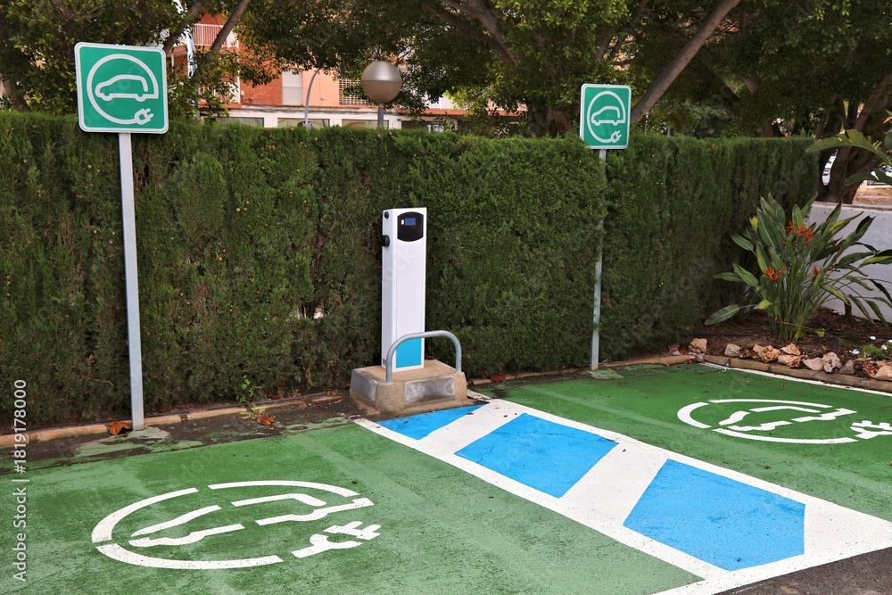 Fototapeta premium Electric vehicle charging station parking spot in Alicante, Spain.