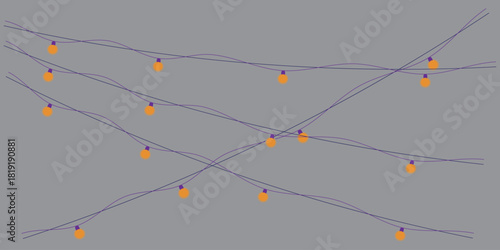 String lights with orange bulbs on a gray background