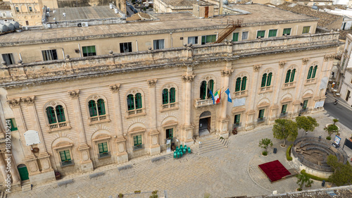 Fototapeta Naklejka Na Ścianę i Meble -  Aerial closeup of the city hall of Scicli, a small town in the province of Ragusa, Sicily, Italy. This Baroque-style building is the town's main attraction. It has been used in several film sets.
